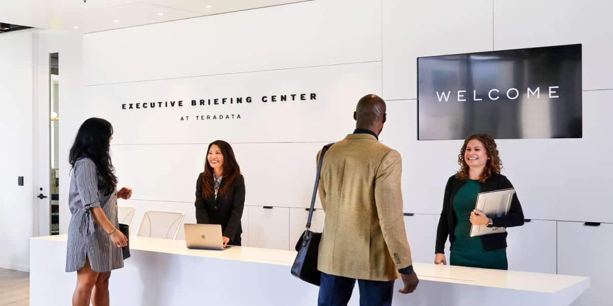 Customers are greeted at the Executive Briefing Center front desk.